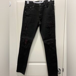 Today $9.    Black jeans distressed with red stones. Unisex New